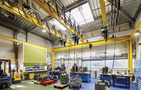 Injection mold maintenance shop uses three suspension cranes to increase productivity by 25%